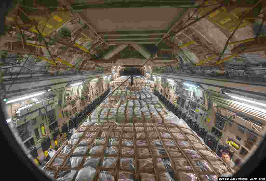 Hundreds of boxes of infant formula arrived from Switzerland are loaded on a C-17 Globemaster III at Ramstein Air Base, Germany, May 22, 2022, for transport to the United States. (U.S. Air Force photo by Staff Sgt. Jacob Wongwai) &nbsp;