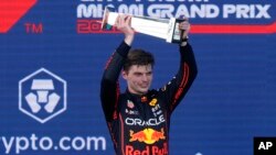 Red Bull driver Max Verstappen of the Netherlands holds up the winner's trophy at the Formula One Miami Grand Prix auto race at the Miami International Autodrome, in Miami Gardens, Florida, May 8, 2022.