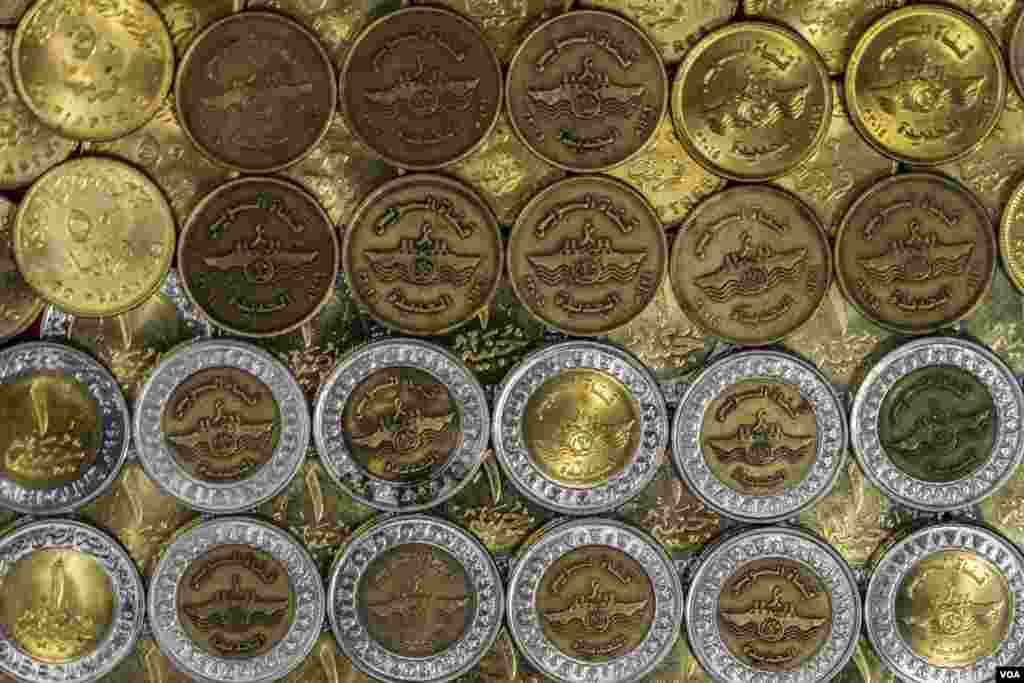The 2015 opening of the new corridor of the Suez Canal is commemorated on Egyptian coins. (Hamada Elrasam/VOA)