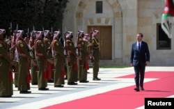 LIST - Israel's President Isaac Herzog receives public reception during diplomatic visit to Amman, Jordan, March 30, 2022 (Haim Zach / Government News / via Reuters)