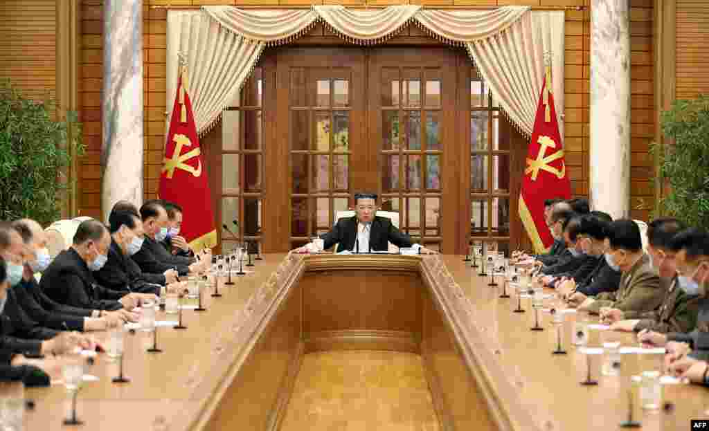 North Korean leader Kim Jong Un, center, attends the 8th political bureau meeting of the Workers Party of Korea in Pyongyang, in this picture taken and released from North Korea&#39;s official Korean Central News Agency.