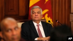 FILE - Then-Sri Lankan Prime Minister Ranil Wickremesinghe attends a meeting with media representatives and civil society members at his office in Colombo, Sri Lanka, Oct. 30, 2019. On Thursday, Wickremesinghe was reappointed to lead the country's government.