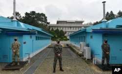 FILE - In this Sept. 16, 2020, file photo, U.S. and South Korean soldiers stand guard during an official visit to Panmunjom in the Demilitarized Zone, South Korea.