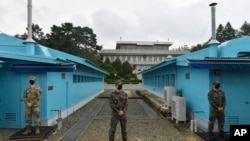 FILE - In this Sept. 16, 2020, file photo, U.S. and South Korean soldiers stand guard during an official visit to Panmunjom in the Demilitarized Zone, South Korea.