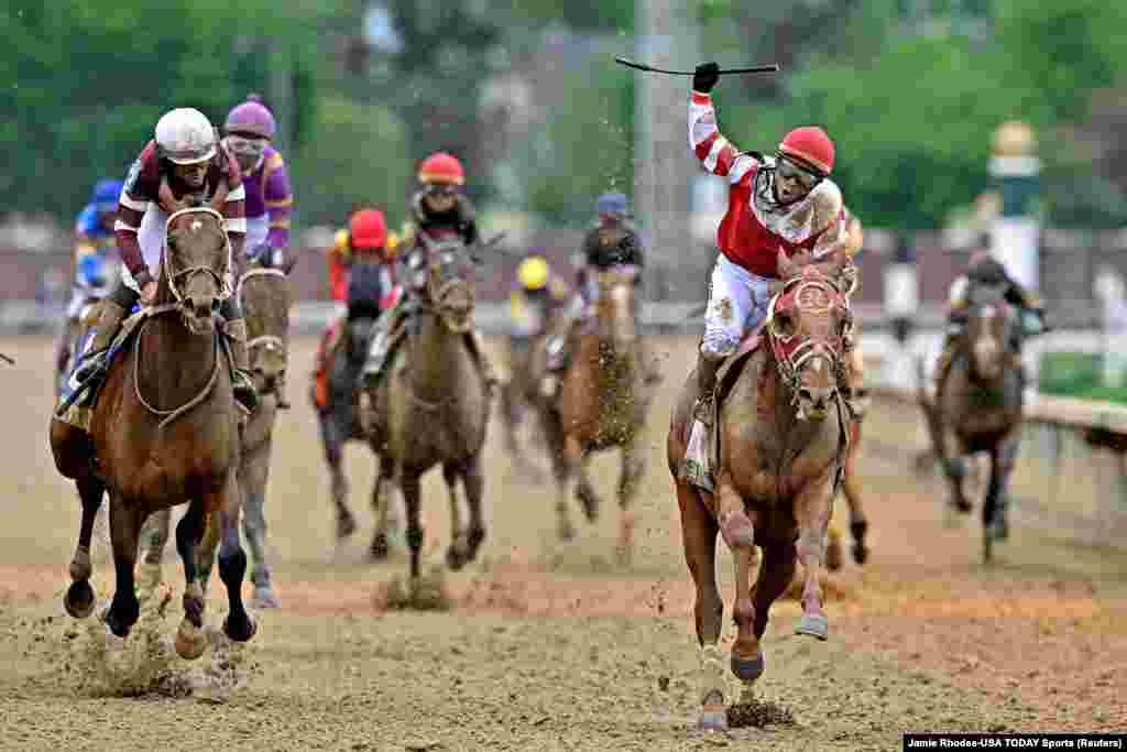 Sonny Leon aboard Rich Strike celebrates winning the 148th running of the Kentucky Derby at Churchill Downs in Louisville, Kentucky, May 7, 2022.