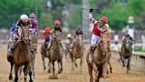 May 7, 2022; Louisville, KY, USA; Sonny Leon aboard Rich Strike celebrates winning the 148th running of the Kentucky Derby at Churchill Downs. 