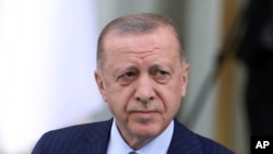 FILE - Turkish President Recep Tayyip Erdogan arrives for a welcoming ceremony for his Algerian counterpart, Abdelmadjid Tebboune, in Ankara, Turkey, on May 16, 2022. Erdogan is taking an increasingly tough line against the NATO membership bids of Finland and Sweden.