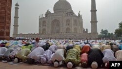 Muslim devotees offer a special morning prayer to start the Eid al-Fitr festival, which marks the end of their holy fasting month of Ramadan, inside the complex of Taj Mahal in Agra, India, May 3, 2022.