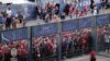 Liverpool fans stand outside, unable to get in on time, leading to the match being delayed prior to the UEFA Champions League Final football match between Liverpool and Real Madrid, at the Stade de France in Saint-Denis, north of Paris, May 28, 2022. 