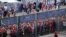 Liverpool fans stand outside, unable to get in on time, leading to the match being delayed prior to the UEFA Champions League Final football match between Liverpool and Real Madrid, at the Stade de France in Saint-Denis, north of Paris, May 28, 2022. 