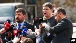 Mykhailo Podolyak, adviser to Ukrainian President Volodymyr Zelenskyy and member of the Ukrainian delegation, center right, speaks to the media after talks between Russian and Ukrainian delegations, in Istanbul, March 29, 2022. 