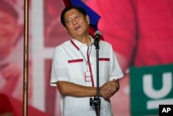 Presidential candidate, Ferdinand Marcos Jr., the son of the late dictator, reacts to the crowd at their last campaign rally known as "Miting De Avance", May 7, 2022 in Paranaque city, Philippines.