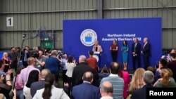 Sinn Fein deputy leader Michelle O'Neill speaks on stage, after Sinn Fein took the most votes in Northern Ireland's assembly election, at the Meadowbank Sports Arena count center, in Magherafelt, Northern Ireland, May 7, 2022. 