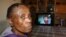 Evelyn Itumeleng is confined to a wheelchair in her Kagiso home west of Johannesburg. She is one of hundreds of thousands of South Africans suffering from infectious and non-commuicable diseases. (Photo by Darren Taylor)