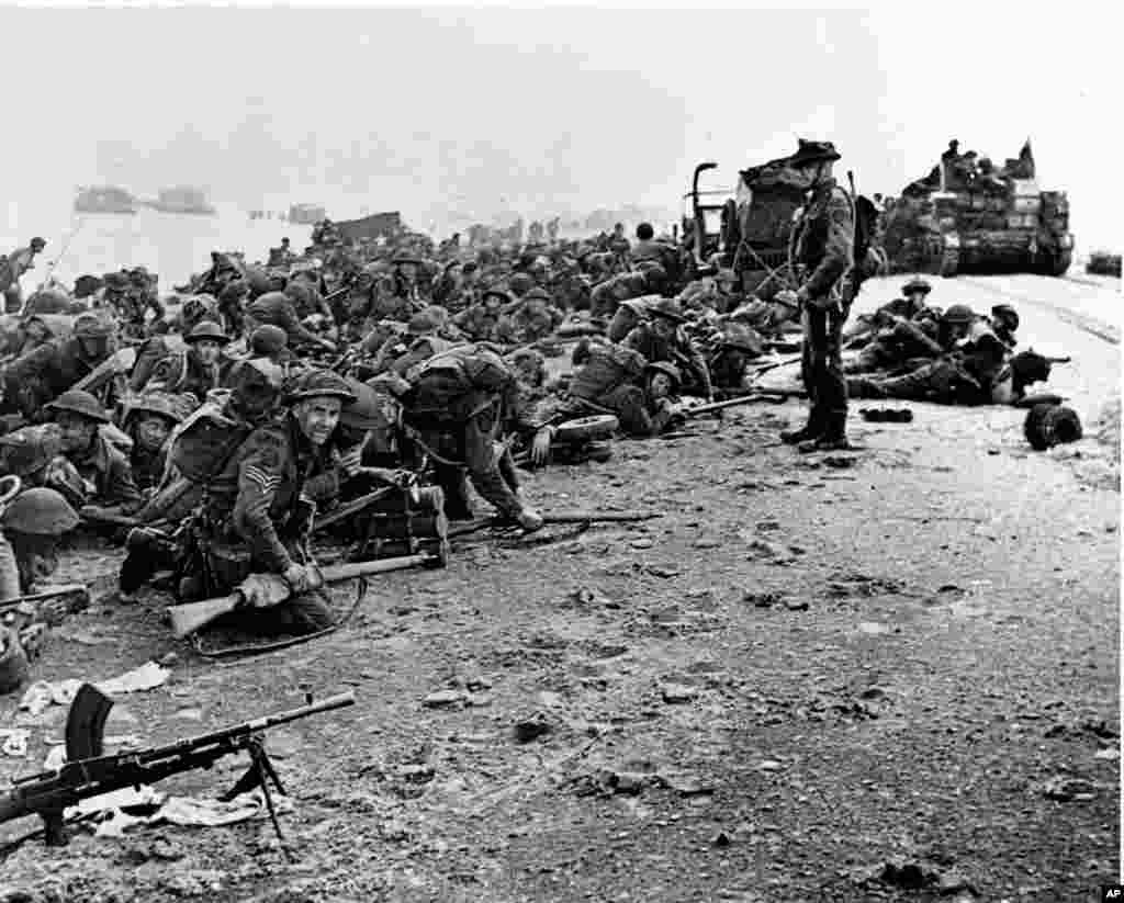 British troops wait for the signal to move forward during the early Allied landing operations in Normandy, France, June 6, 1944.&nbsp;