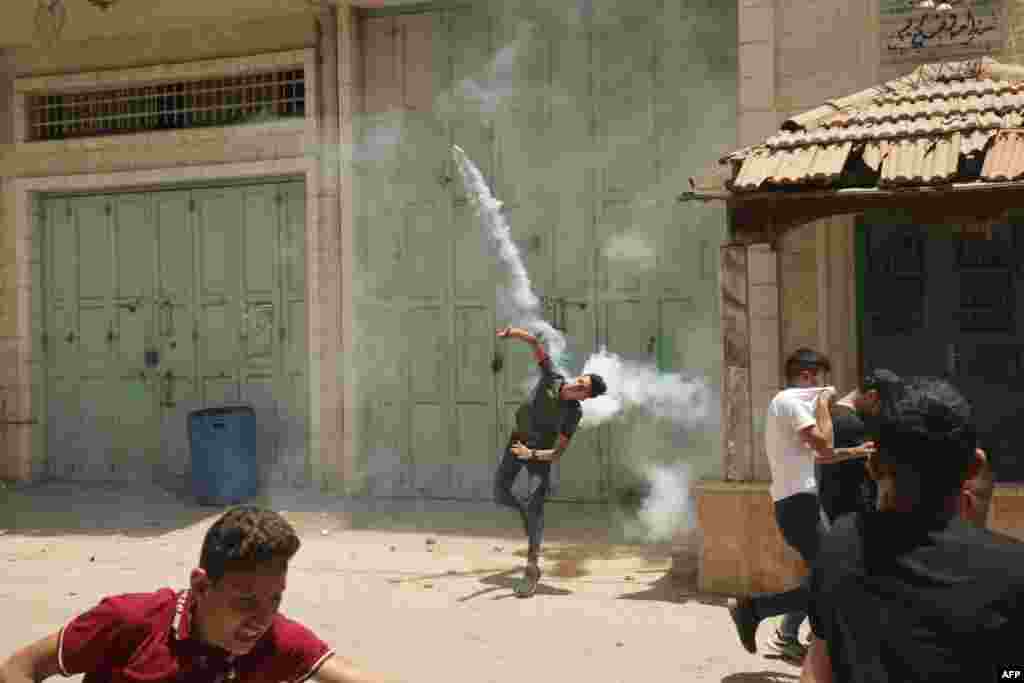 Palestinians clash with Israeli security forces during the funeral of Ghofran Warasnah, killed after she approached an Israeli soldier with a knife, in Al-Aroub refugee camp north the West Bank city of Hebron.