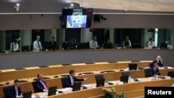 Ukrainian President Volodymyr Zelenskiy speaks during a special meeting of the European Council at The European Council Building in Brussels, May 30, 2022. 