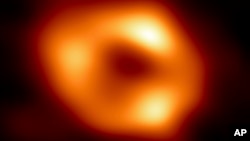 This image released by the Event Horizon Telescope Collaboration, Thursday, May 12, 2022, shows a black hole called Sagittarius A* at the center of our Milky Way galaxy. It is 4 million times more massive than our sun. (Event Horizon Telescope Collaboration via AP)