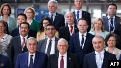 Josep Borrell (C) and other attendees pose for a family picture during the 6th Sixth Brussels Conference on 'Supporting the future of Syria and the region' at the European Council in Brussels, May 10, 2022.