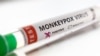 FILE: Test tube labelled "Monkeypox virus positive" are seen in this illustration taken May 22, 2022.