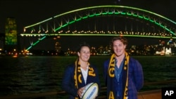 Wallabies captain Michael Hooper stands with Wallaroos captain Shannon Parry ahead of the final vote for the hosting of the Rugby World Cups in Sydney, Australia, May 12, 2022.