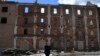 A woman called Albina, reacts in front of the destroyed Peter Dick's mill that had been damaged in Russian shelling in the village of Niu-York, Donetsk region, Ukraine, May 16, 2022. Photo: Associated Press