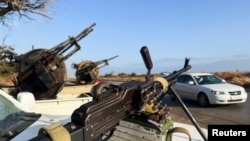 Military vehicles mounted with heavy weapons belonging to pro-PM Dbeibah Constitution Protection Force are pictured in Tripoli, Libya, May 17, 2022. 