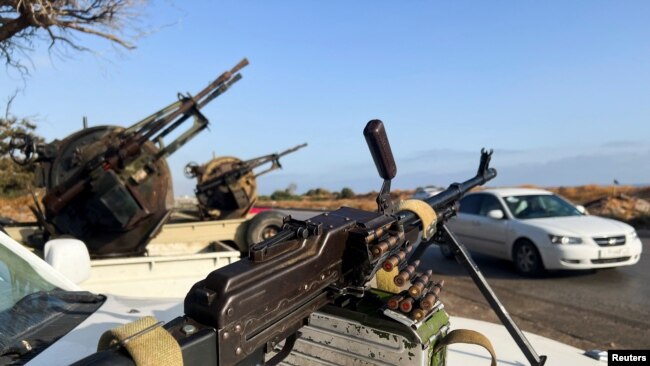 Military vehicles mounted with heavy weapons belonging to pro-PM Dbeibah Constitution Protection Force are pictured in Tripoli, Libya, May 17, 2022.