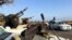 FILE - Military vehicles mounted with heavy weapons belonging to pro-PM Dbeibah Constitution Protection Force are pictured in Tripoli, Libya, May 17, 2022. 