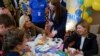 US fIrst lady Jill Biden (L) and Ukraine President wife Olena Zelenska join a group of children making tissue-paper bears for Mothers Day gifts at School 6, a public school that has taken in displaced students in Uzhhorod on May 8, 2022, during an unanno