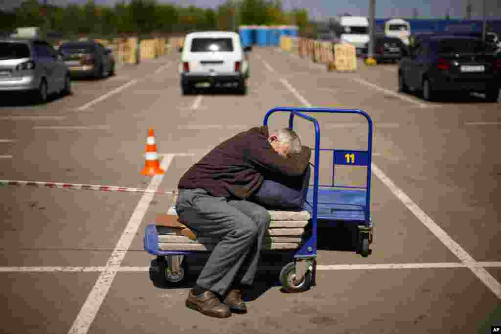 A man who fled from a small village near Polohy rests upon his arrival to a reception center for displaced people in Zaporizhzhia, Ukraine.
