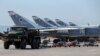 FILE - Russian military jets are seen at Hmeymim air base in Syria, June 18, 2016. 