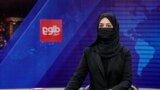 FILE - TV anchor Khatereh Ahmadi reads the news on TOLO NEWS, in Kabul, Afghanistan, May 22, 2022. The Taliban government suspended, April 16, 2024, the broadcast of two privately run local TV channels over alleged violations of official regulations and “Islamic values.”