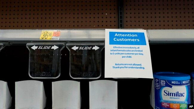 FILE - Shelves typically stocked with baby formula sit mostly empty at a store in San Antonio, May 10, 2022.