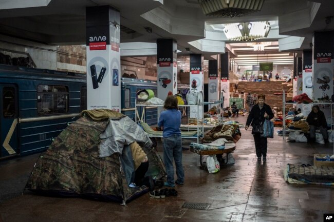 Residents live in a subway station still used as temporary shelter in Kharkiv, eastern Ukraine, Tuesday, May 24, 2022. (AP Photo/Bernat Armangue)