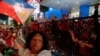 Supporters of Philippine president-elect Ferdinand 'Bongbong' Marcos Jr., son of late dictator Ferdinand Marcos, celebrate outside his headquarters in Mandaluyong City, Metro Manila, Philippines, May 11, 2022. 