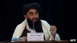 FILE - Taliban spokesman Zabihullah Mujahid addresses a press conference in Kabul, Afghanistan, Feb. 27, 2022.