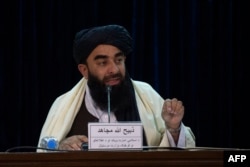 FILE - Taliban spokesman Zabihullah Mujahid addresses a press conference on Feb. 27, 2022.