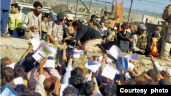 A crowd surges at Abbey Gate outside Kabul Airport in late August of 2021. Najeebullah returned home with a dislocated shoulder, carrying his daughter who sustained a concussion when the crowd knocked her to the ground. (Courtesy - Najeebullah)