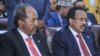 Newly-elected Somali President Hassan Sheikh Mohamud (L) sits next to former President Mohamed Abdullahi Mohamed, in the capital Mogadishu, May 16, 2022.