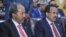 Newly-elected Somali President Hassan Sheikh Mohamud (L) sits next to former President Mohamed Abdullahi Mohamed, in the capital Mogadishu, May 16, 2022.