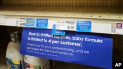A sign at a grocery store in Salt Lake City tells customers about a limit on baby formula on May 10, 2022.
