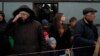 Adults and children from Mariupol and nearby towns step out a bus, having arrived at a refugee center fleeing from the war, in Zaporizhzhia, Ukraine, April 21, 2022.