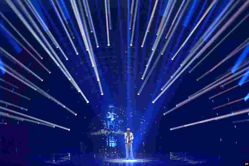 Jeremie Makiese from Belgium sings "Miss You" during rehearsals at the Eurovision Song Contest in Turin, Italy.