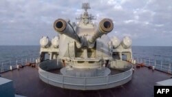 FILE - This handout video grab released by the Russian defense ministry Feb. 12, 2022, shows a gun turret of a Russian ship as it sails in the Black Sea off the Crimean port of Sevastopol. 