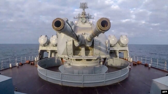 FILE - This handout video grab released by the Russian defense ministry Feb. 12, 2022, shows a gun turret of a Russian ship as it sails in the Black Sea off the Crimean port of Sevastopol.