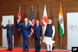 Leaders of Quadrilateral Security Dialogue (Quad) from left to right, Australian Prime Minister Anthony Albanese, U.S. President Joe Biden, Japanese Prime Minister Fumio Kishida, and Indian Prime Minister Narendra Modi, pose for photo at the entrance hall