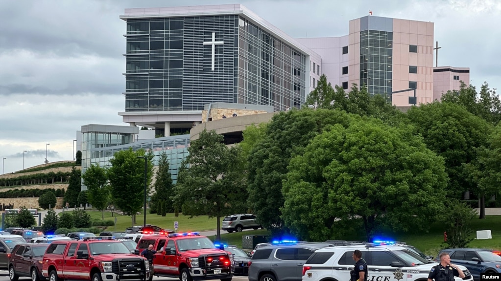 Emergency personnel work at the scene of a shooting at a medical clinic in Tulsa, Okla., June 1, 2022. 