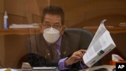 Judge Miguel Angel Galvez presides over a court during a hearing for a drug case, in Guatemala City, May 11, 2022. 