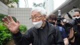 Catholic Cardinal Joseph Zen leaves after an appearance at a court in Hong Kong as he was charged in relation to their past fundraising for activists, May 24, 2022.